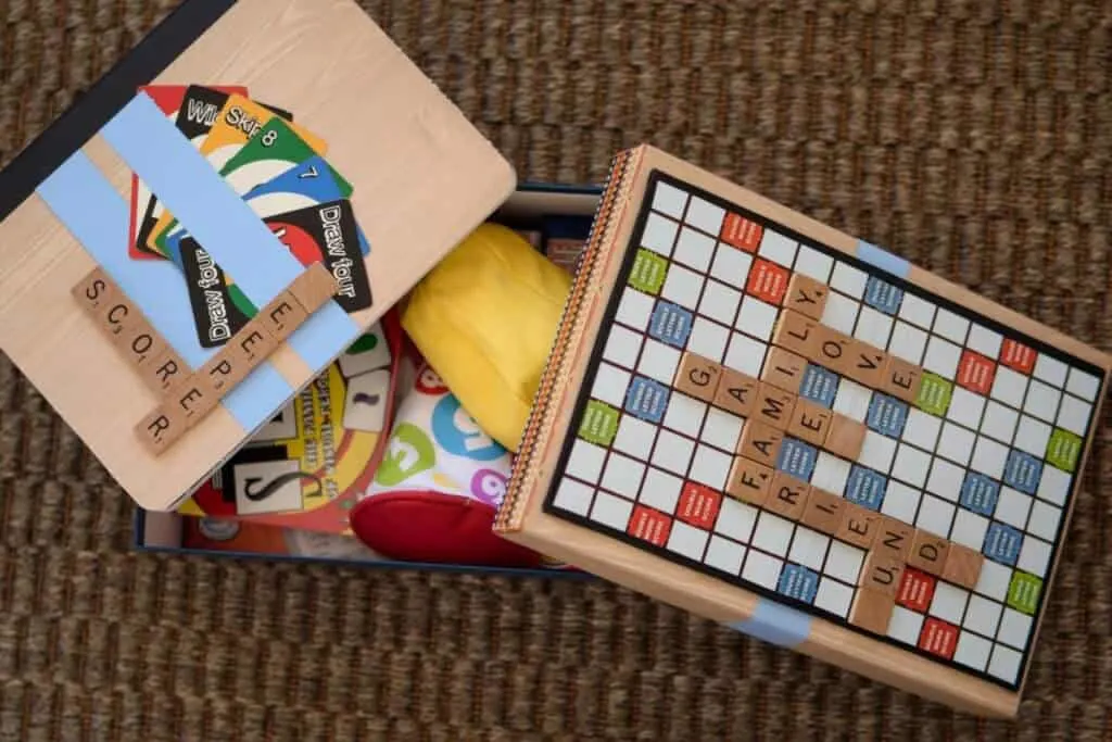 a homemade game box with a scrabble theme.