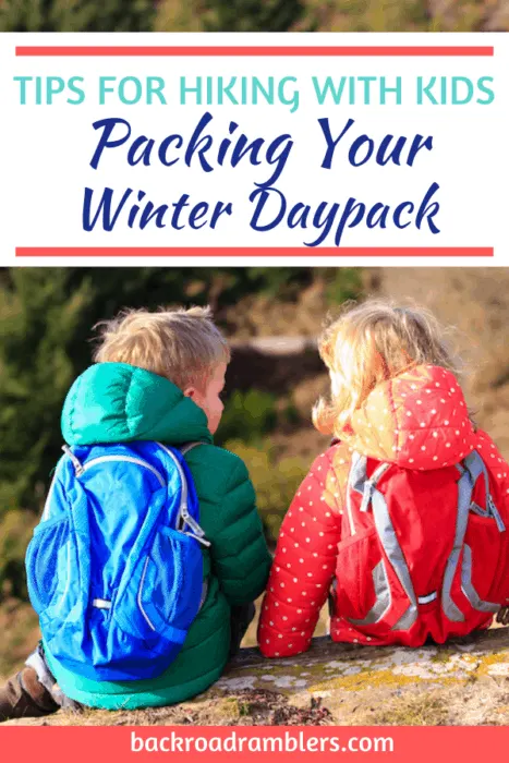 Two kids sitting with their backs to the camera. They are wearing colorful clothing and daypacks. Caption reads: Tips for Hiking with Kids. Packing your winter daypack.