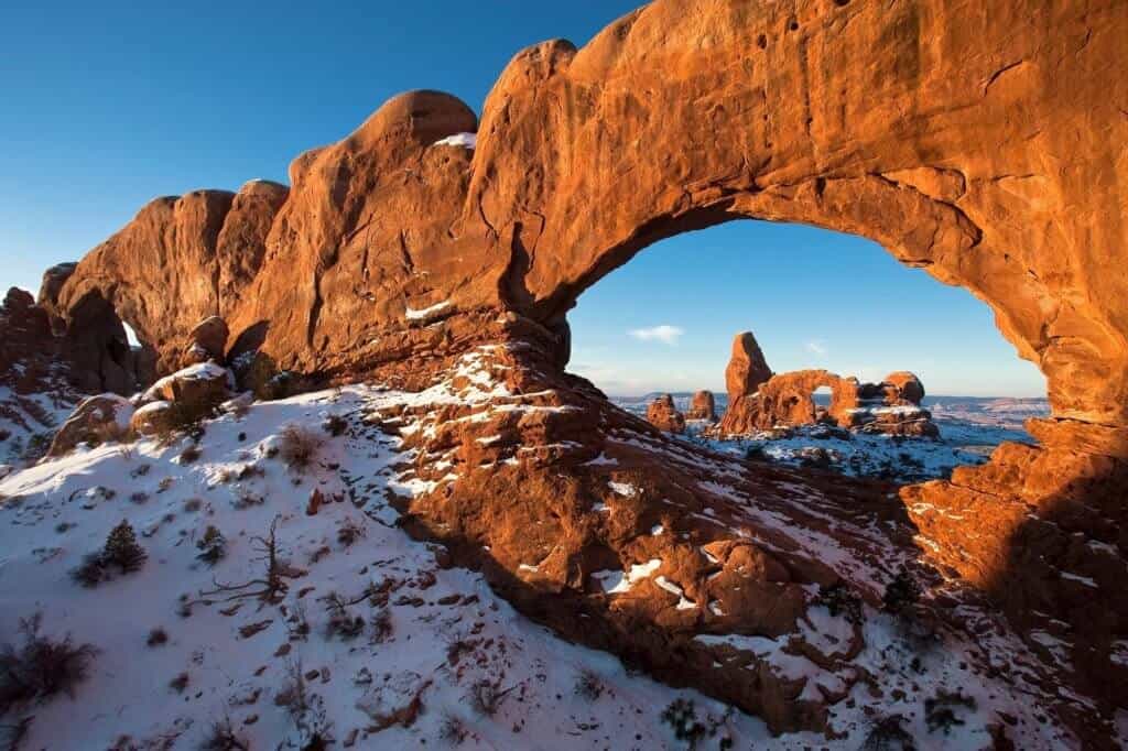 A snowy view of Arches National Park in the winter