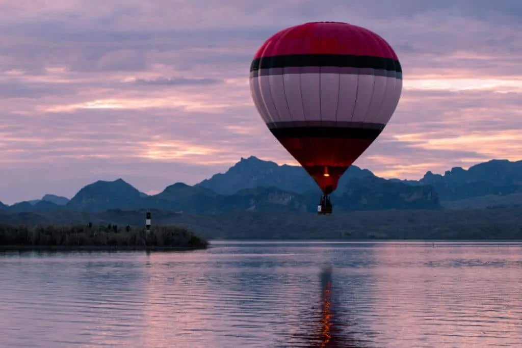 A hot air balloon rises above Lake Havasu at the Lake Havasu Balloon Fesitval. 