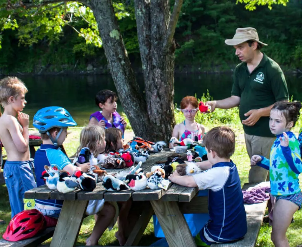 A ranger teaches bird identification to kids in Vermont.