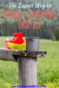 A bench outdoors with a stack of dishes on it. Caption reads: The easiest way to do your camping dishes.