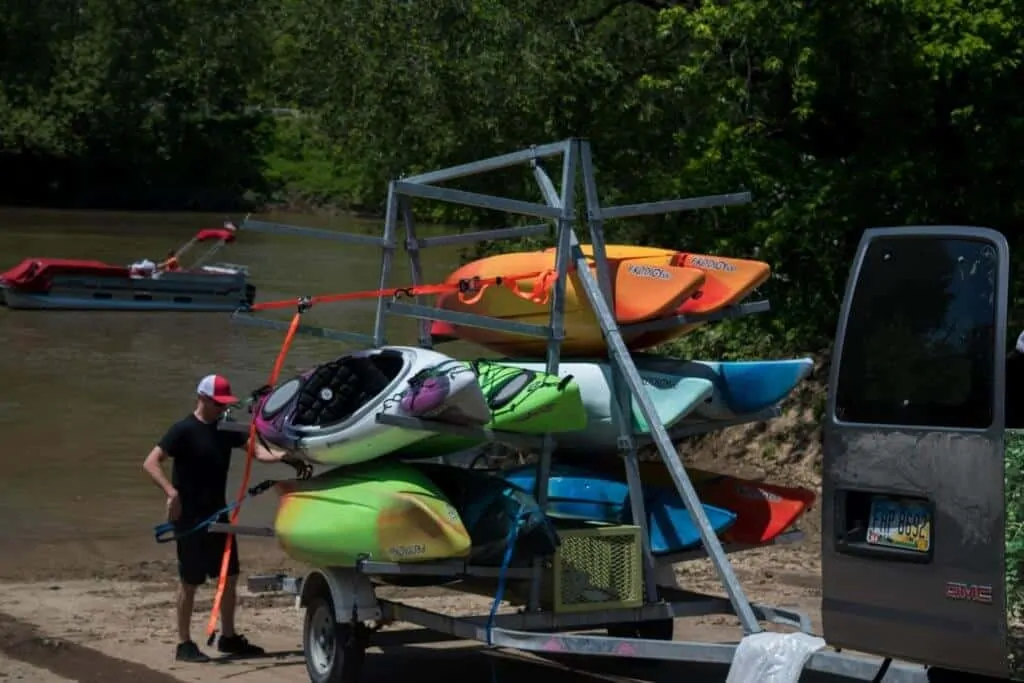 A man unloads kayaks from a trailer in Marietta, Ohio.