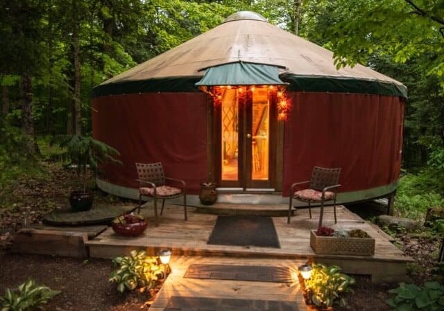 Vermont farm camping a nighttime view of a yurt for rent in Vermont.