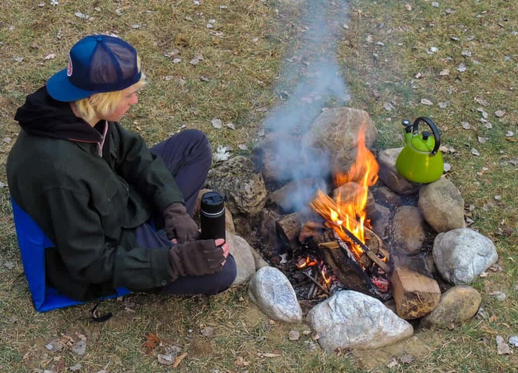 Rowan enjoying a campfire on a recent camping trip.
