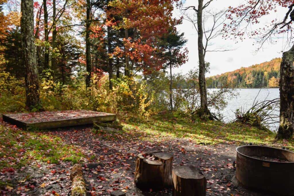 A waterfront campsite in the fall at Grout Pond, VT
