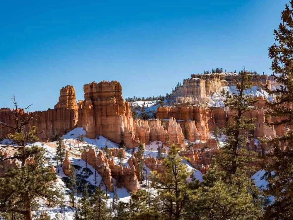 The voodoos in Bryce Canyon during the winter. They are dusted with snow. 