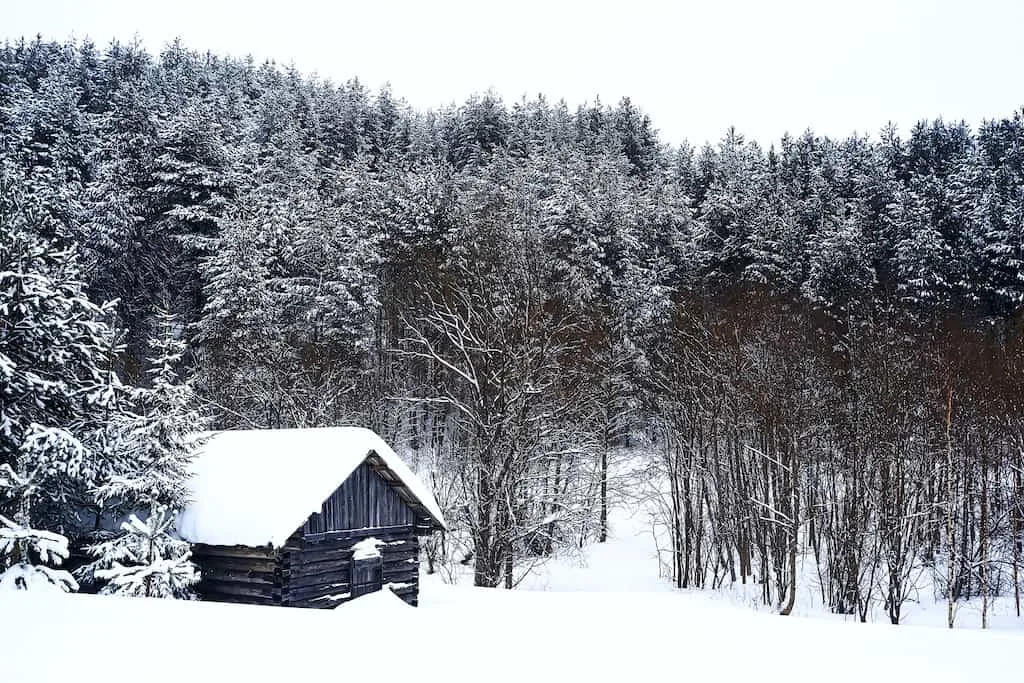 A cabin covered with snow in New England