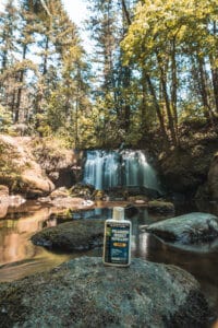 Picaridin lotion from Sawyer in front of a waterfall.