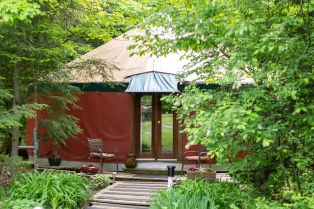a yurt in the woods in New Haven, Vermont. It is for rent on Glamping Hub.