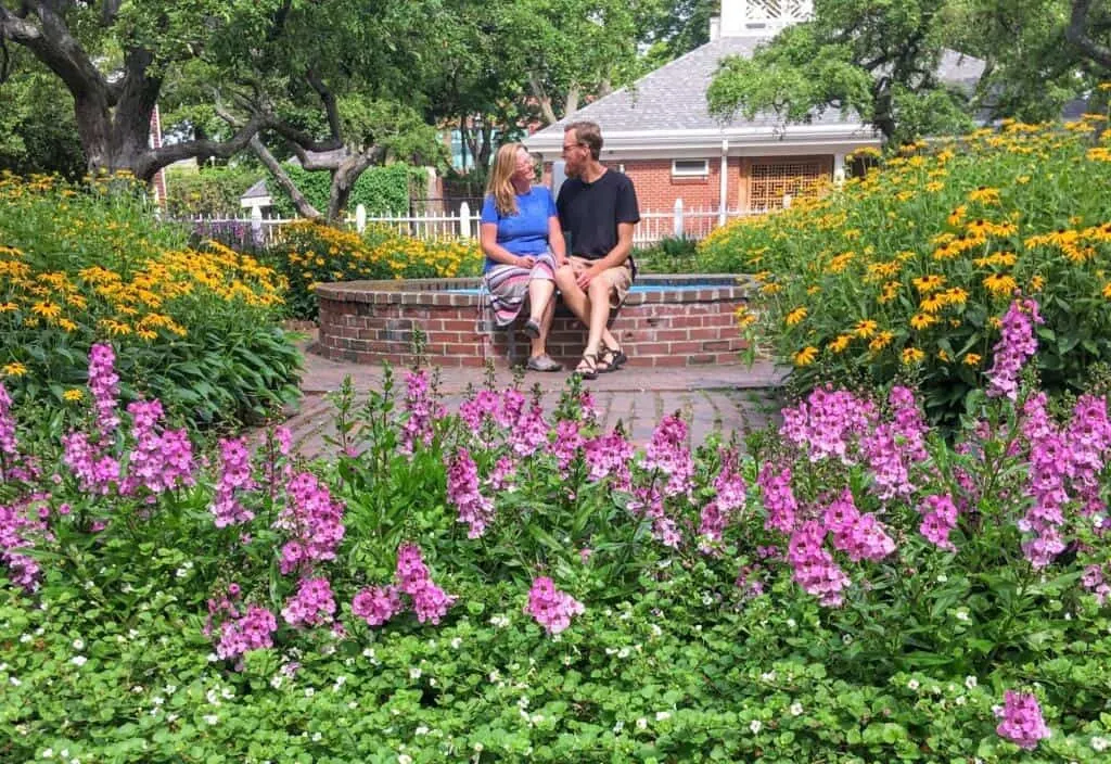 A couple sits near a fountain in Prescott Park in Portsmouth, NH.