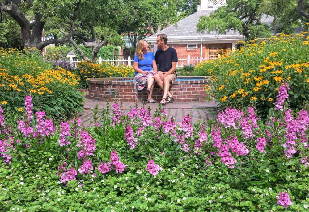 A couple sits near a fountain in Prescott Park in Portsmouth, NH.