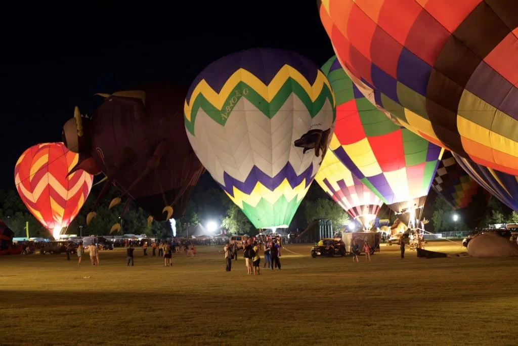 Several hot air balloons on display at the glow during the Plano Balloon Festival in Texas.