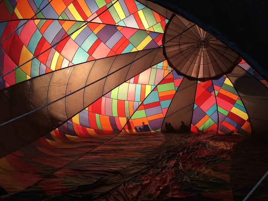 The inside of a balloon during inflation at a hot air balloon festival.
