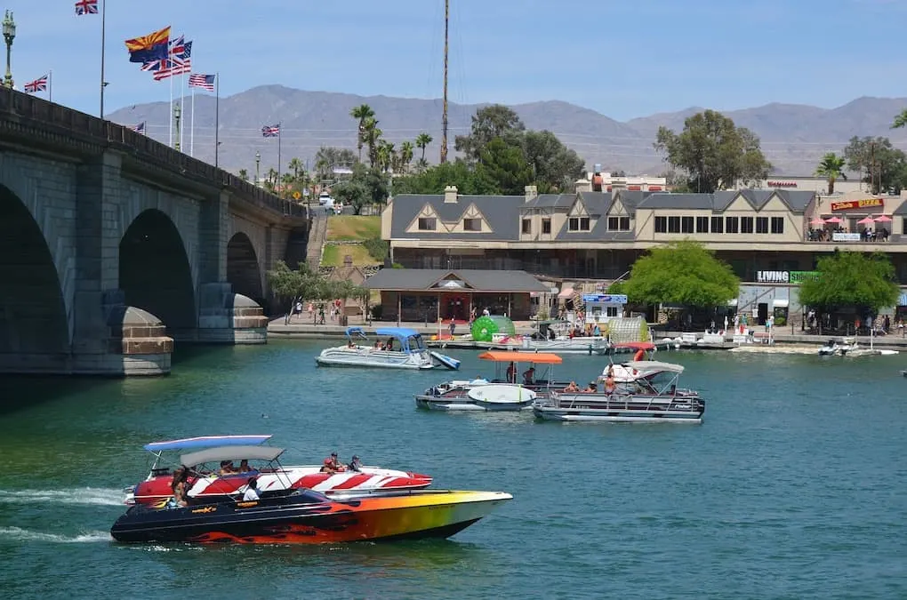 A speed boat zips under the London Bridge in Lake Havasu City, Arizona