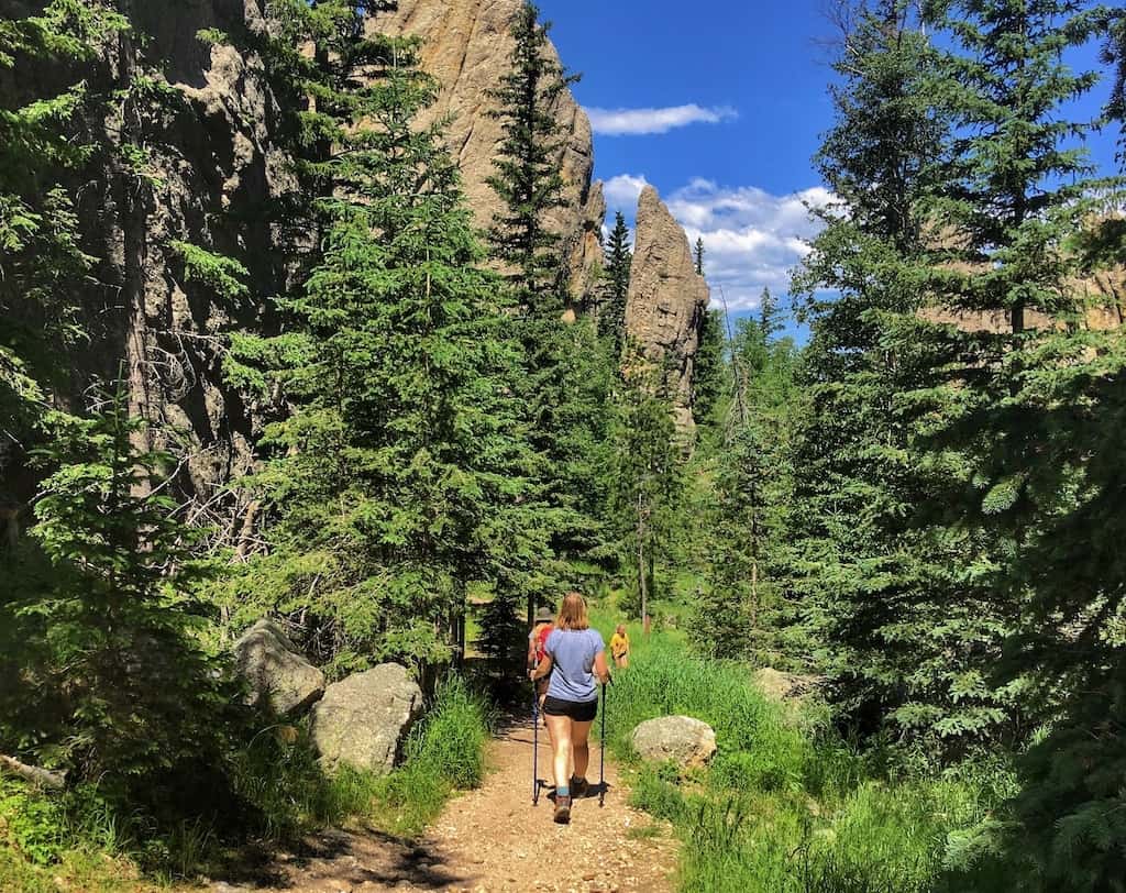 A woman hikes into the Black Hills on the Sunday Gulch Trail in Custer State Park.