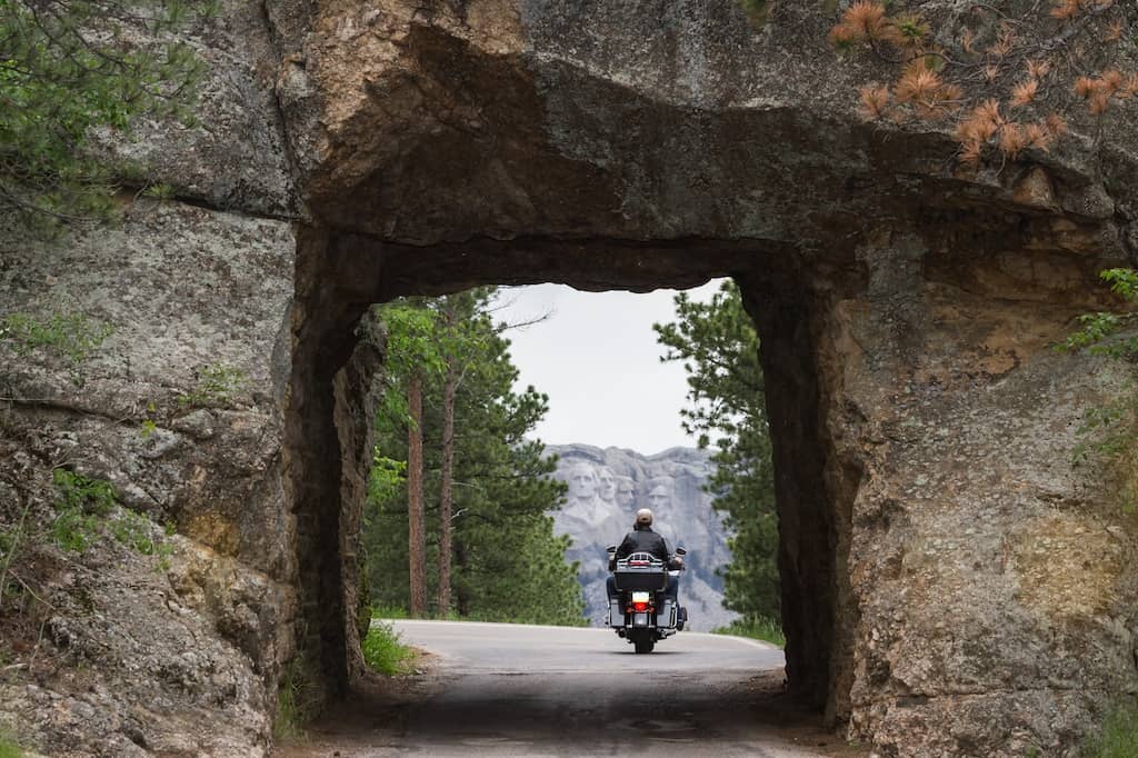 Iron Mountain Road in the Black Hills of South Dakota with Mount Rushmore in the distance