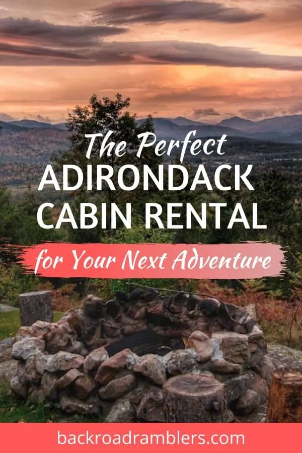 A sunset over the Adirondack Mountains. Caption reads: The Perfect Adirondack Cabin Rental in New York.