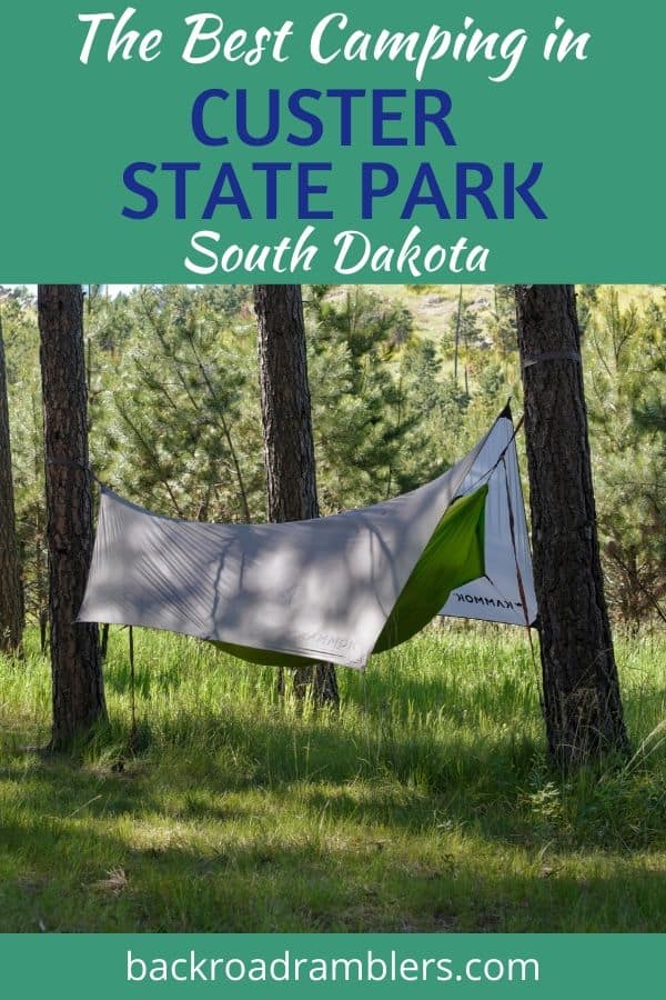 A camping hammock in Blue Bell Campground, Custer State Park. Caption Reads: The Best Camping in Custer State Park, South Dakota.