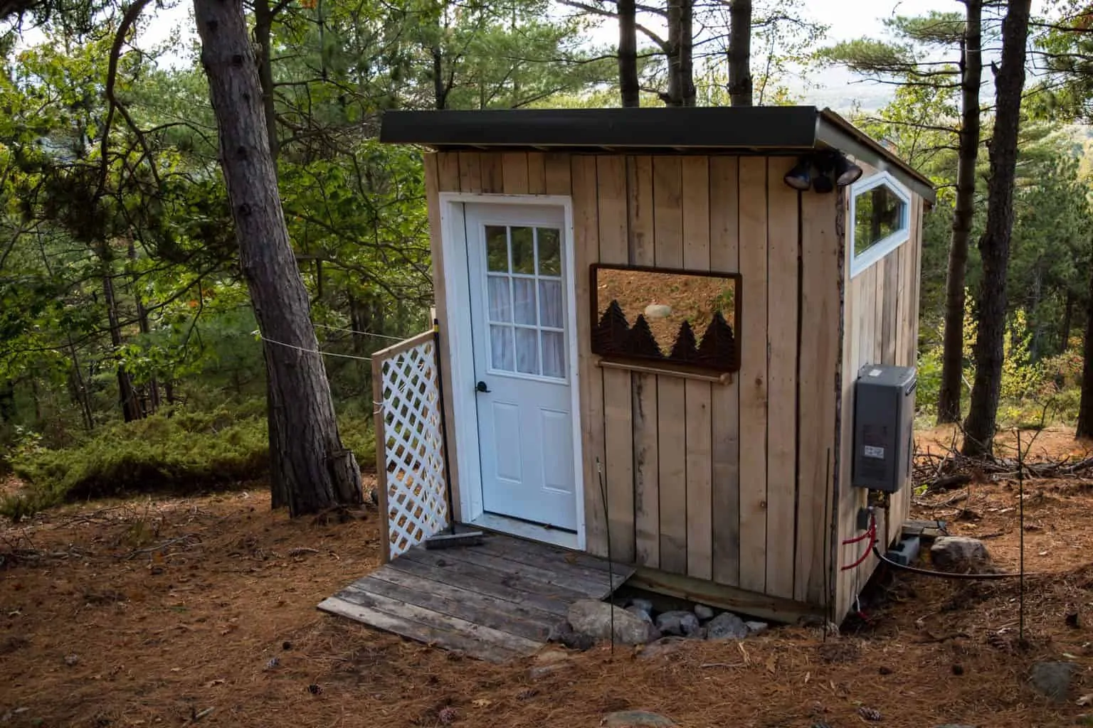 An outdoor shower outside a vacation rental in the Adirondacks of New York.
