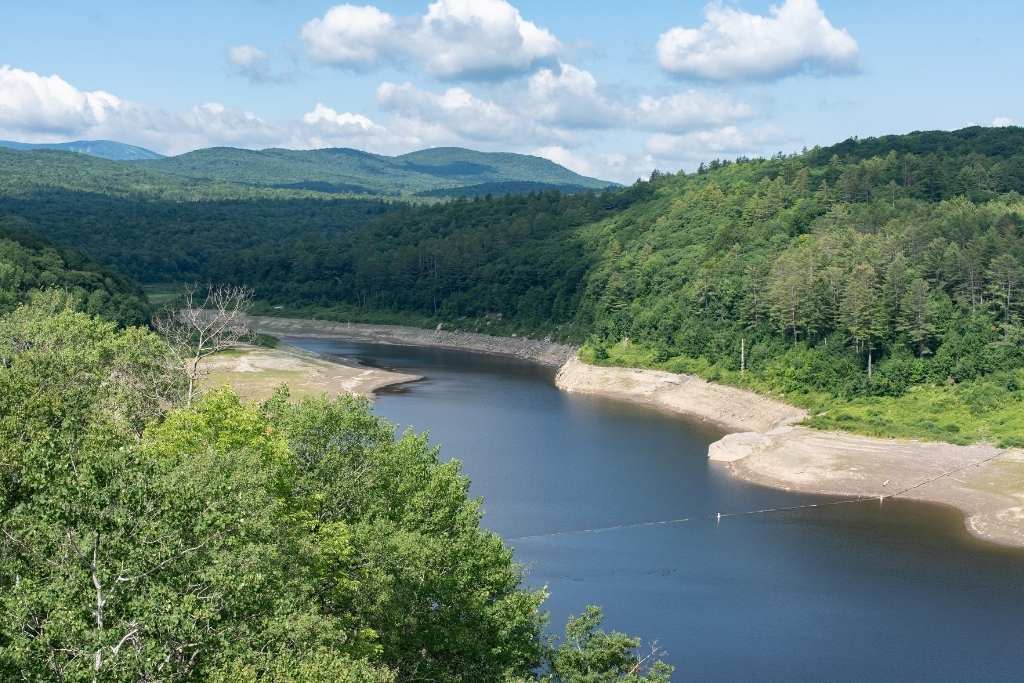 A summer view of Ball Mountain Lake from the top of Ball Mountain Dam near Jamaica State Park in Vermont