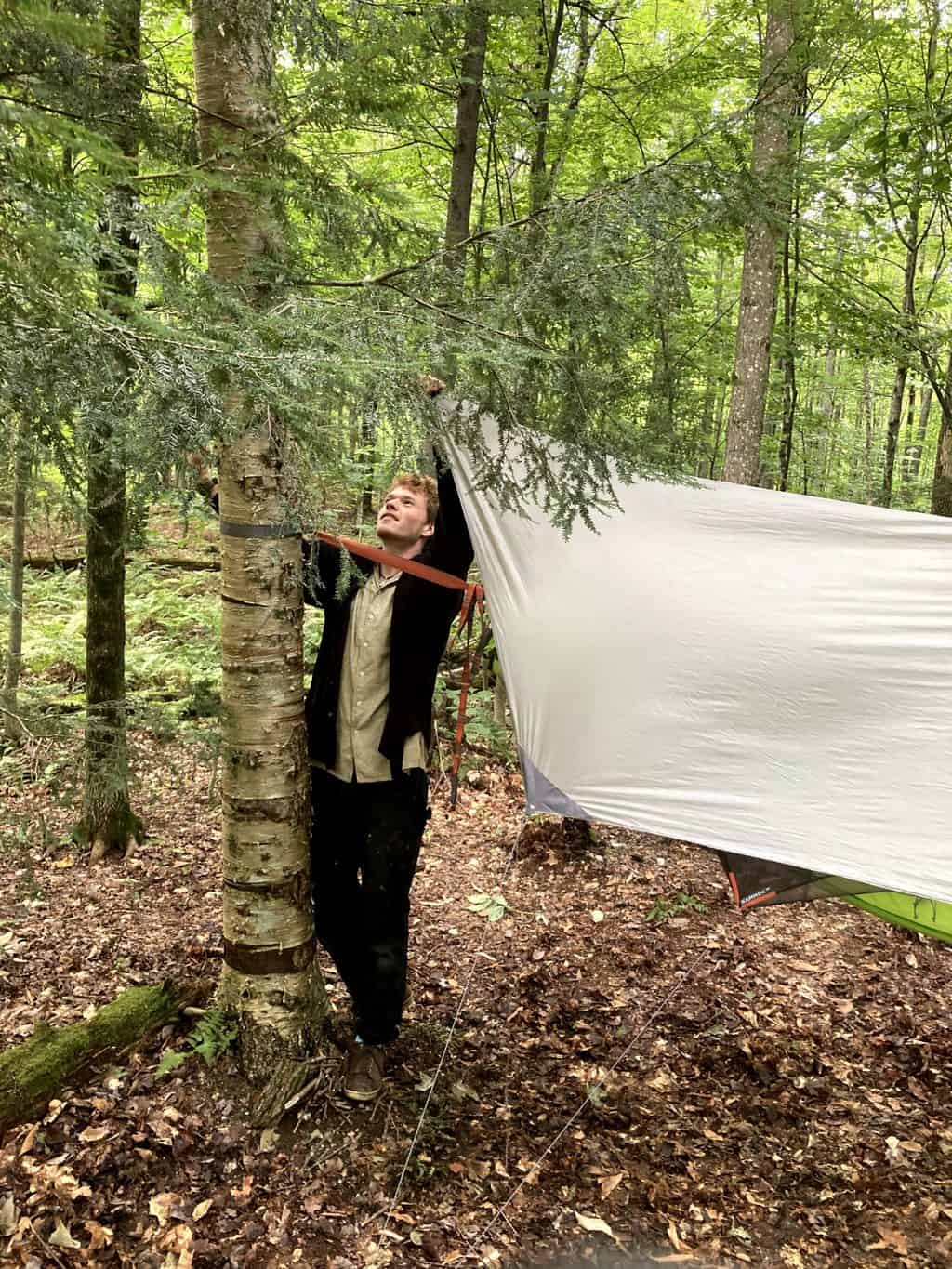 Setting up a hammock for camping at Gifford State Park in Vermont