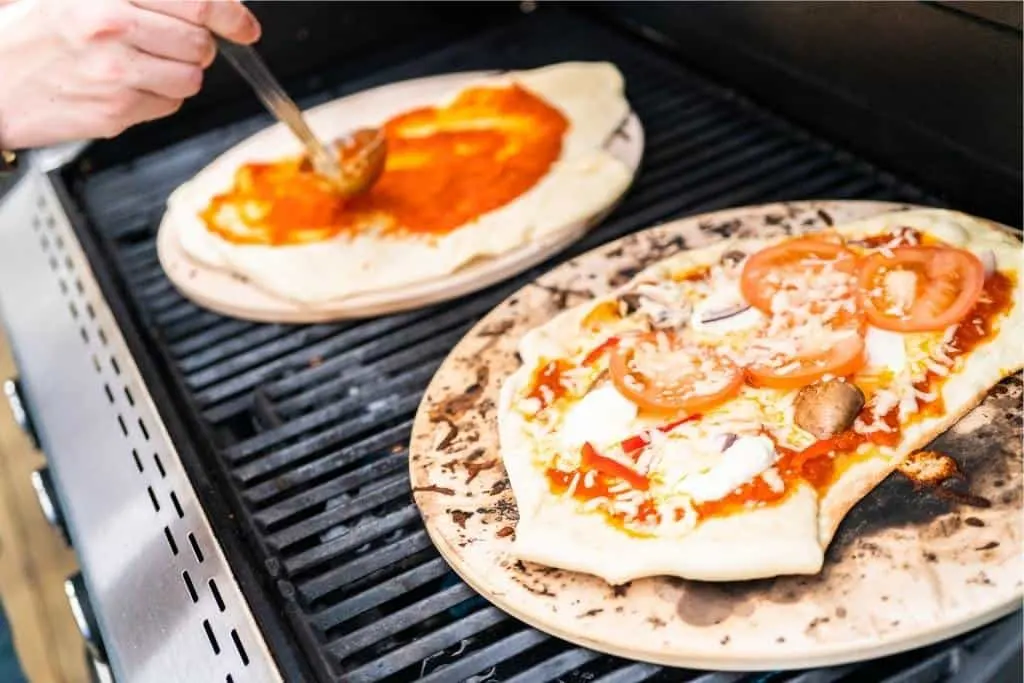 Grilled pizza sitting on a grill