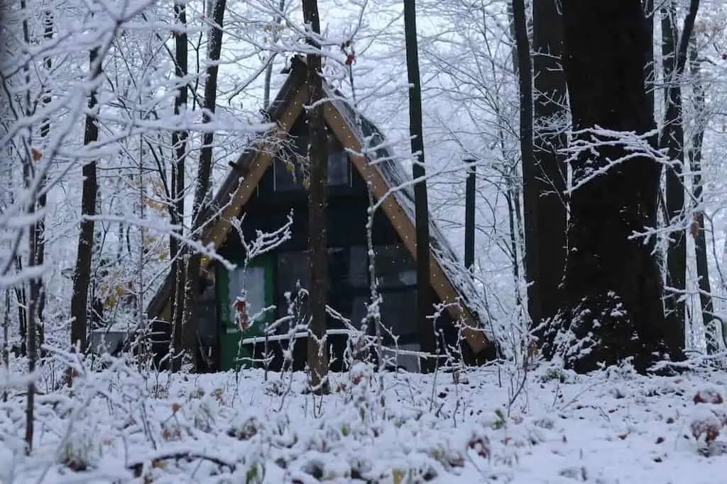 A glamping A-frame covered with snow in Sherburne, New York. Photo credit: Airbnb