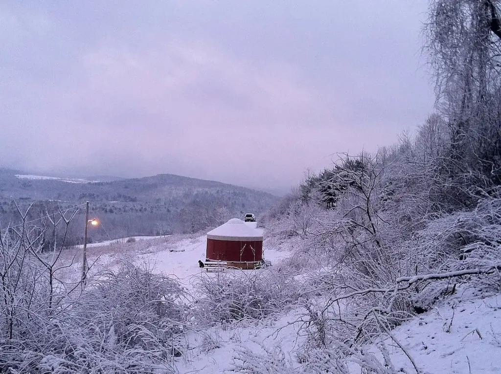 A glamping yurt in a snowy field in Waterville, NY. Photo credit: Airbnb