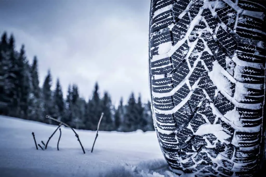 A snow-covered winter tire. 