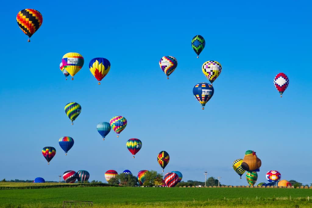 A field full of hot air balloons at the National Balloon Classic in Indianola