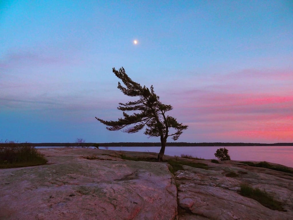 Sunset over Georgian Bay in Killbear Provincial Park, one of the best spots for Great Lakes camping.