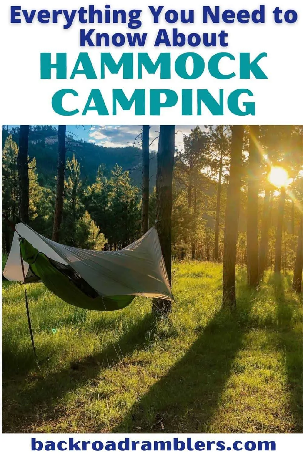 A hammock hangs between two trees as the sun sets behind it. Text overlay: Everything You Need to Know About Hammock Camping