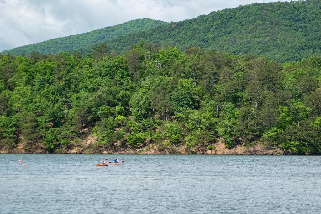 Two kayakers paddling on Carvins Cove in Roanoke Virginia.