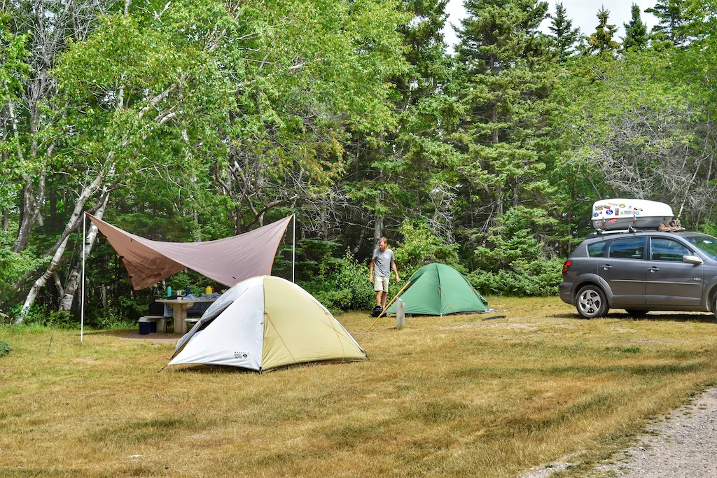 Two tents set up in Broad Cove Campground in Cape Breton Highlands National Park in Nova Scotia.