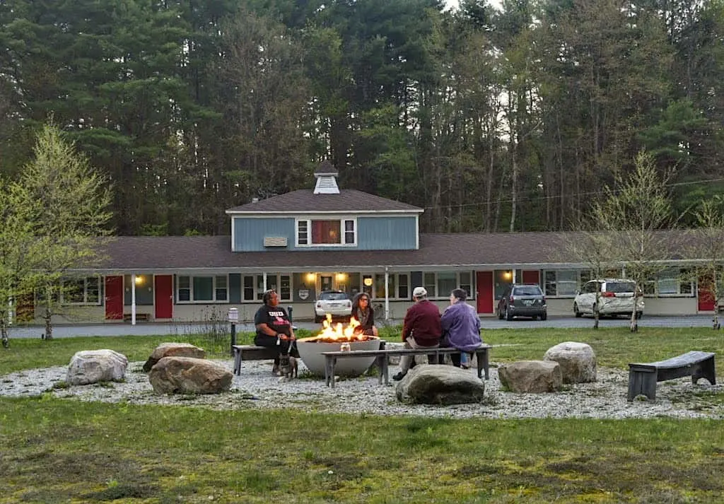 Visitors relaxing around the fire pit at the Briarcliff Motel in Great Barrington, Massachusetts.
