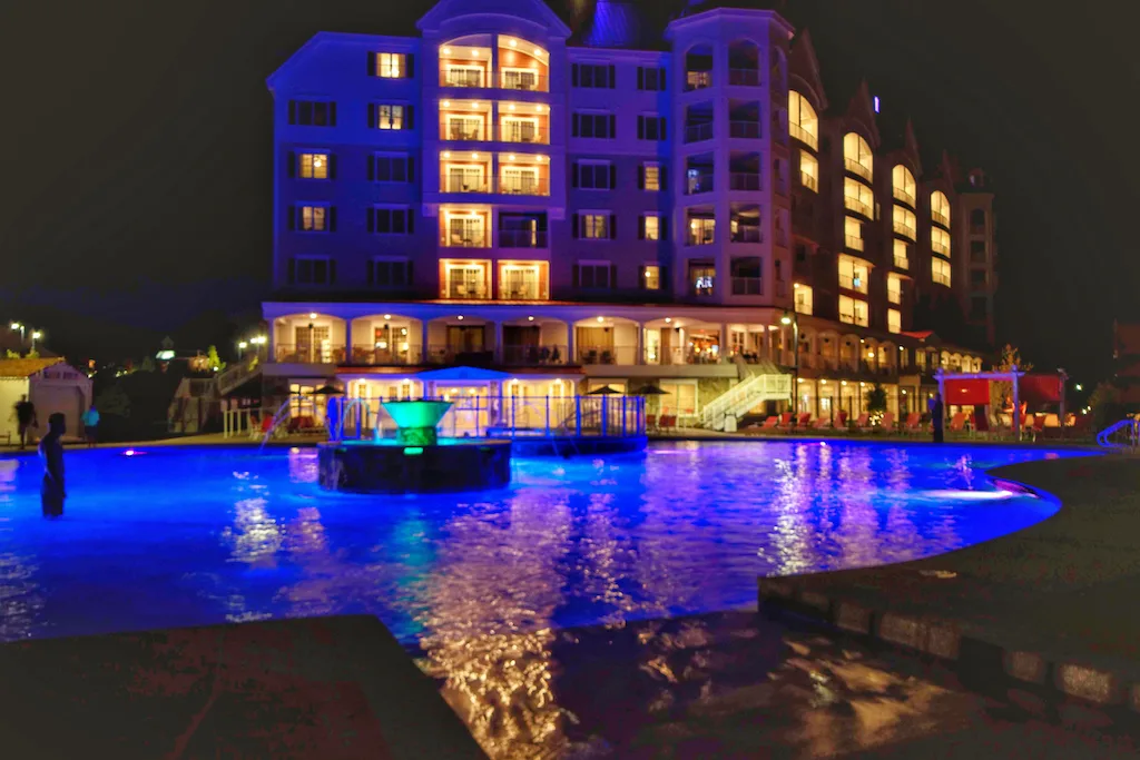 A night view of the pool at RiverWalk Resort at Loon Mountain in New Hampshire.