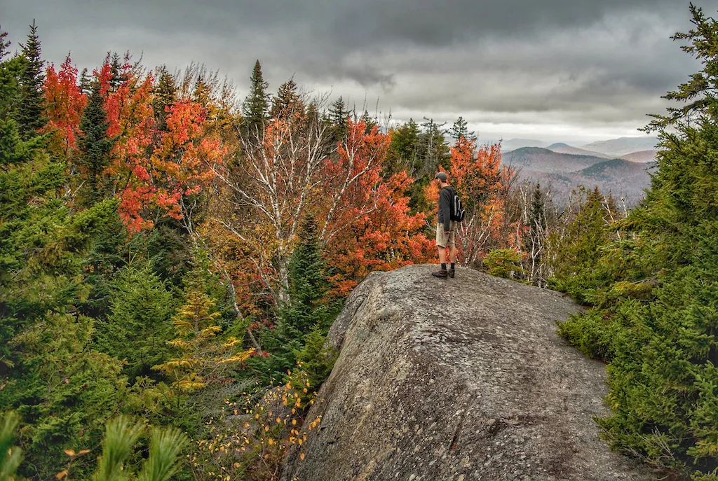 Climbing Mt. Jo in Lake Placid, New York during fall foliage season.
