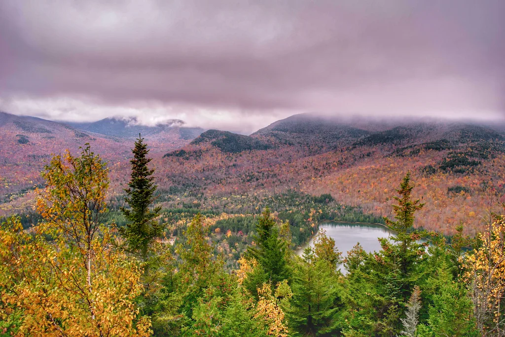 A fall foliage view of Heart Lake from the top of Mt. Jo in Lake Placid, New York.