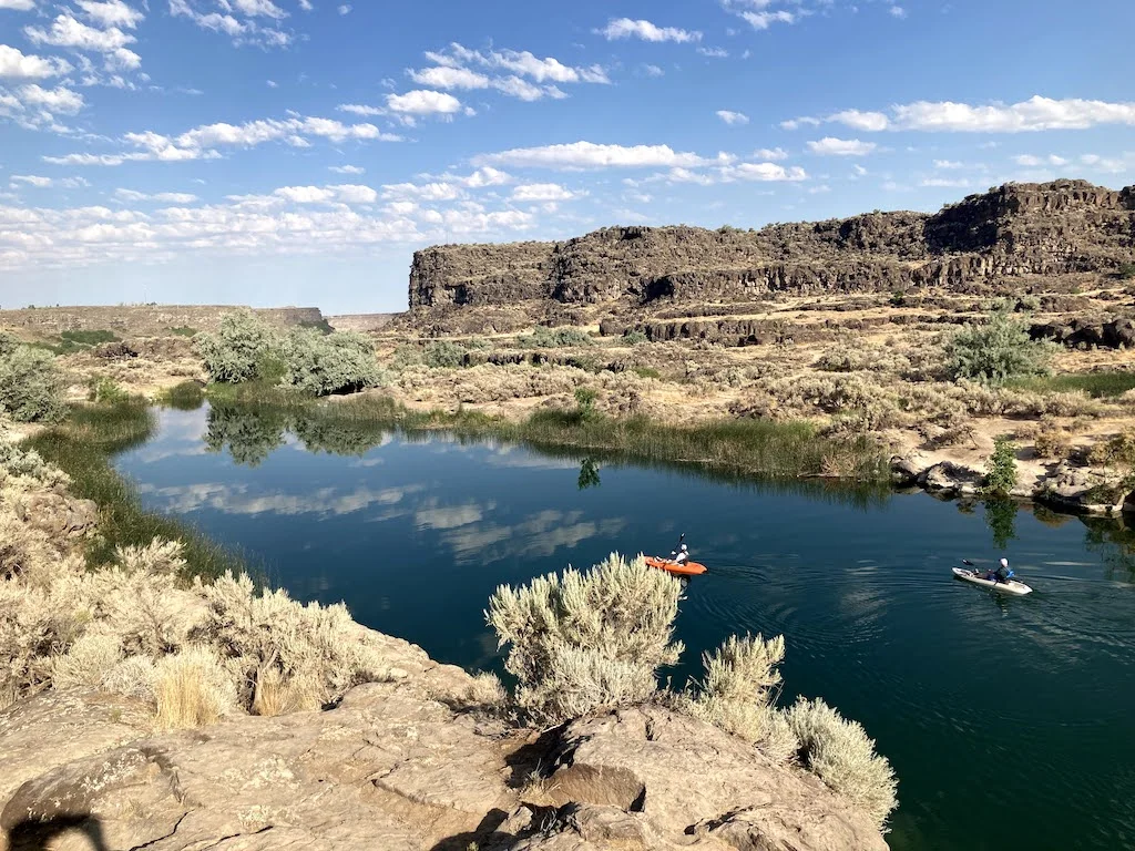 Two paddlers kayaking on Dierkes Lake in Twin Falls, Idaho.