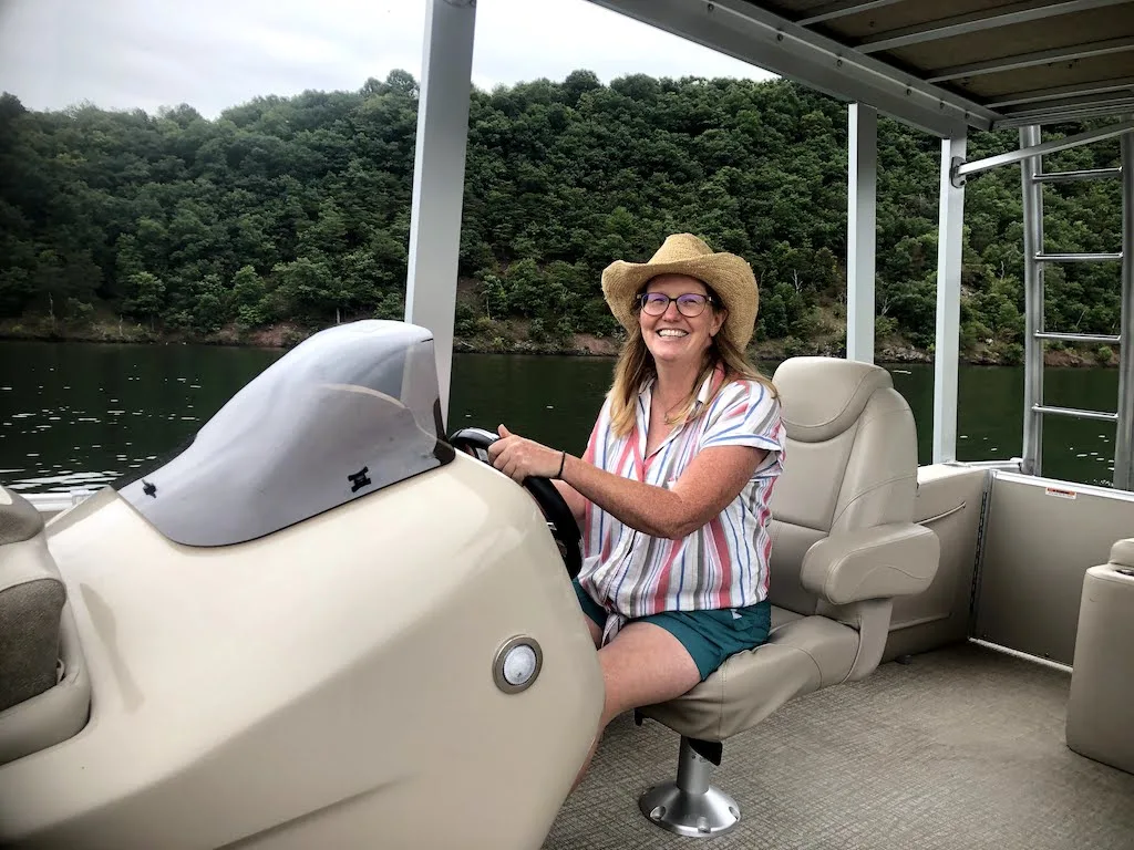 The author driving a boat for the first time on Raystown Lake in Pennsylvania.