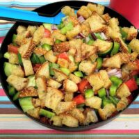 a plate of panzanella salad for camping.