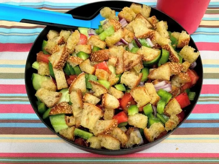 a plate of panzanella salad for camping.