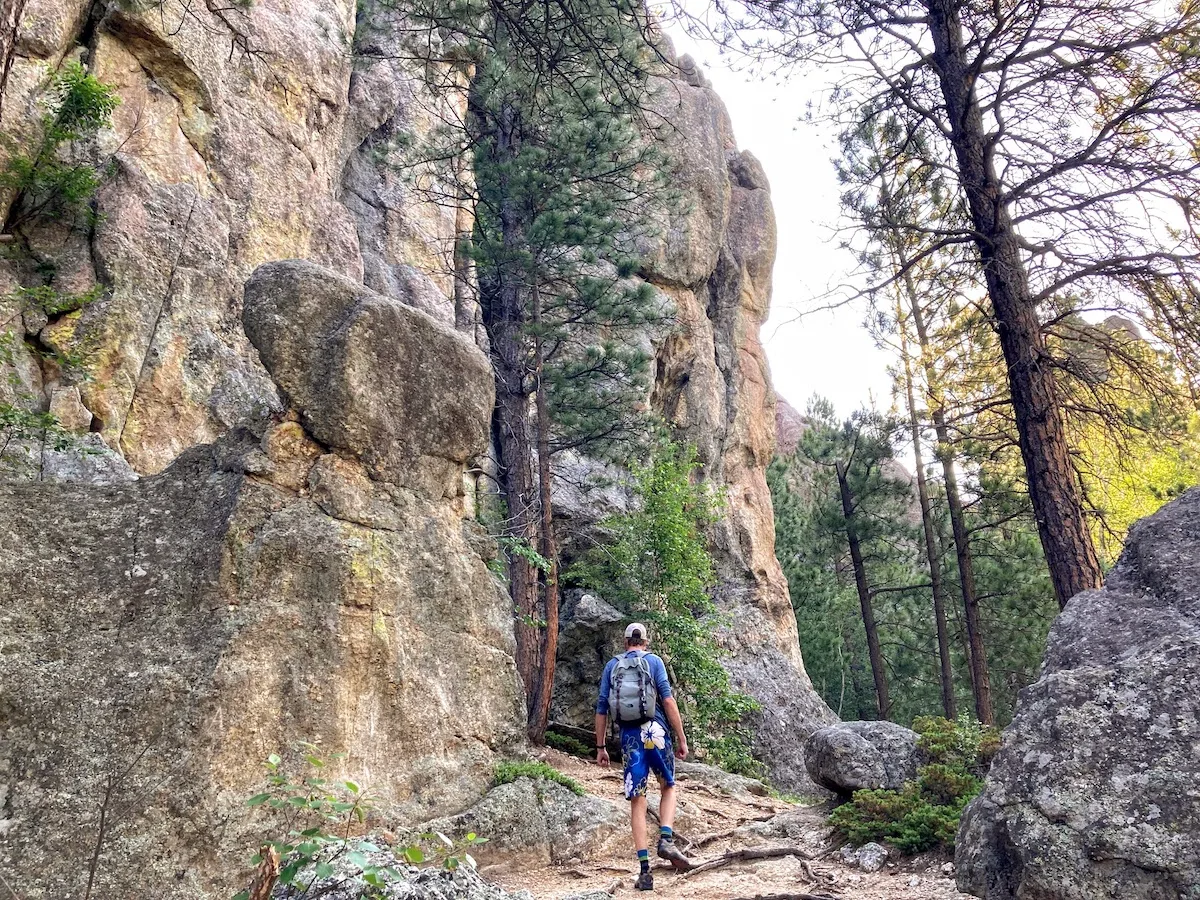 A man hikes on Horsethief Lake Trail in the Black Hills of South Dakota.