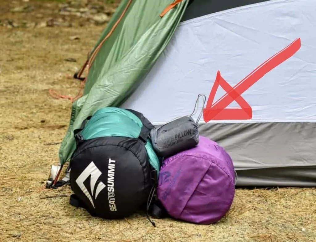 Camping gear next to a tent.