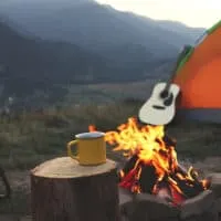 A yellow mug sits on a stump in front of a campfire. There is an orange tent and a guitar in the background.