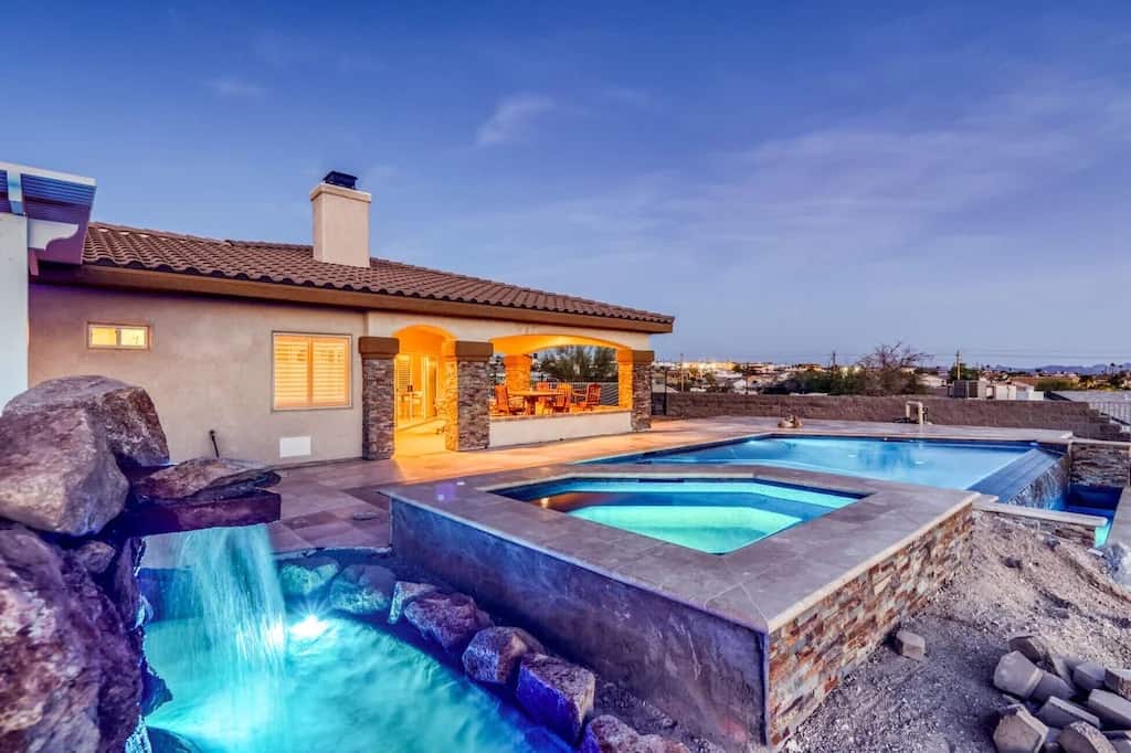 A beautiful Lake Havasu vacation rental on VRBO featuring a waterfall and a pool. Photo credit: VRBO.
