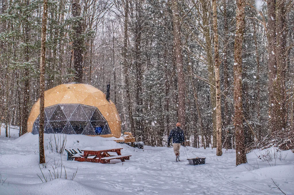 A glamping dome in the snowy Vermont woods.