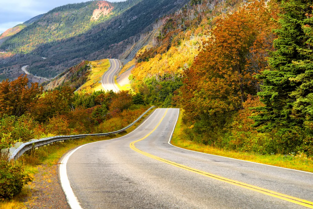 A road along the Cabot Trail in Cape Breton during fall foliage season. 