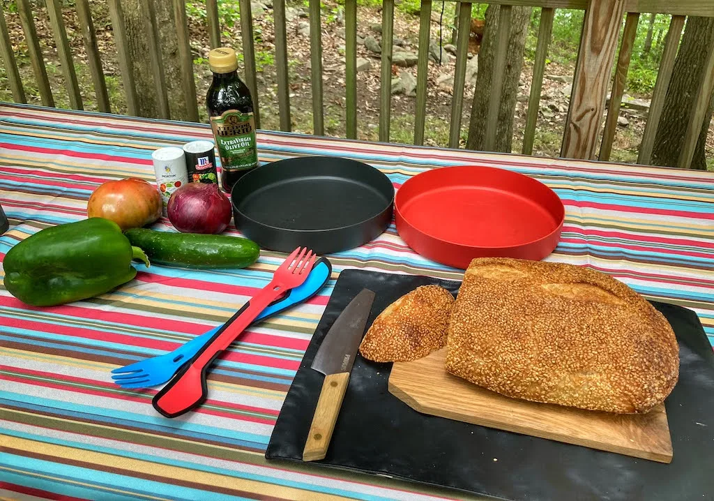 Dinnerware and cookware - part of a car camping kitchen setup.